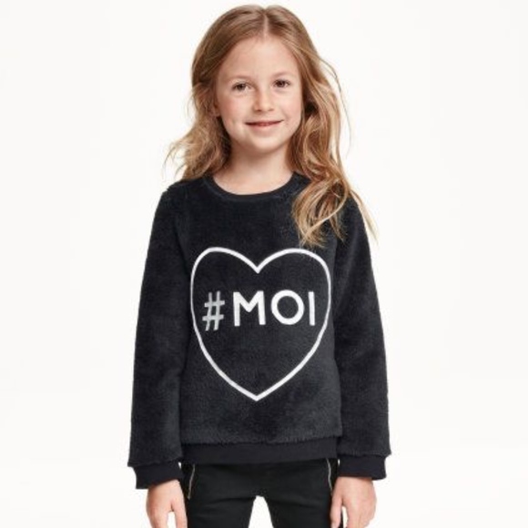 H&M Other - H&M faux fur black sweatshirt with print.